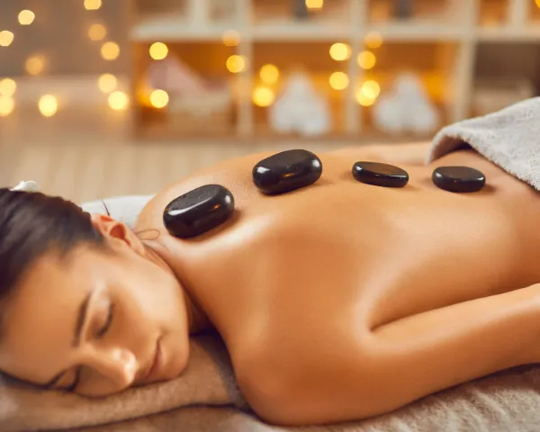Professional Hot Stone Massage Service in Perungudi at Tula Unisex Salon and Spa